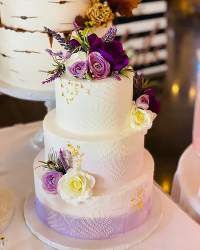White and purple ombre buttercream wedding cake