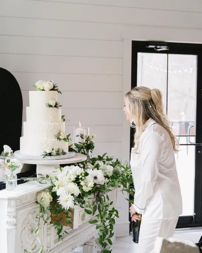 Four-tier white buttercream wedding cake