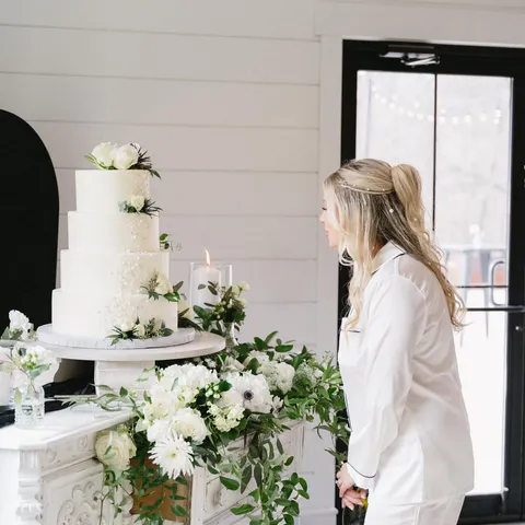 Four-tier white buttercream wedding cake