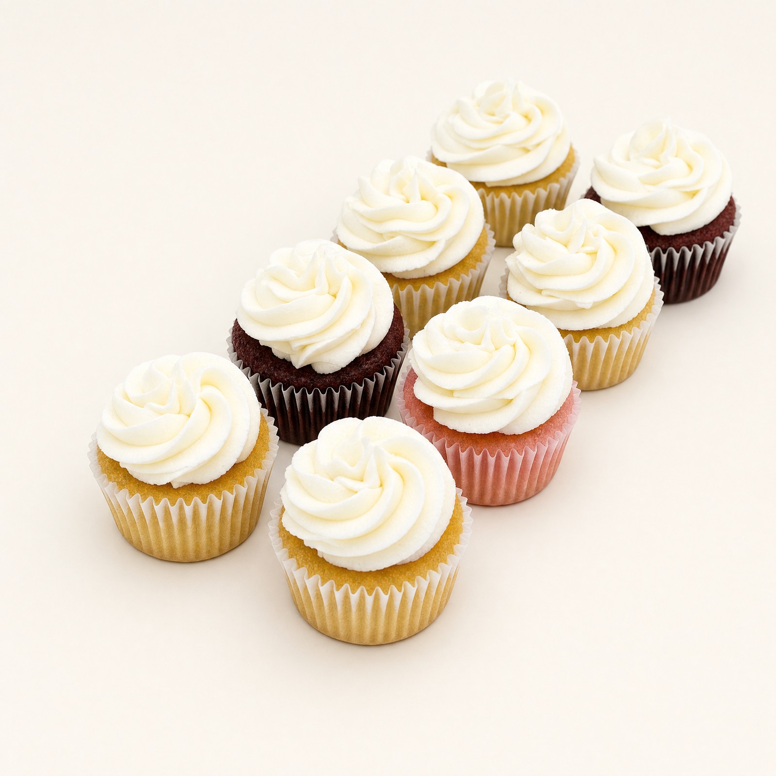 Assorted mini cupcakes showing several of Sweet Escape's 19 signature cake flavors