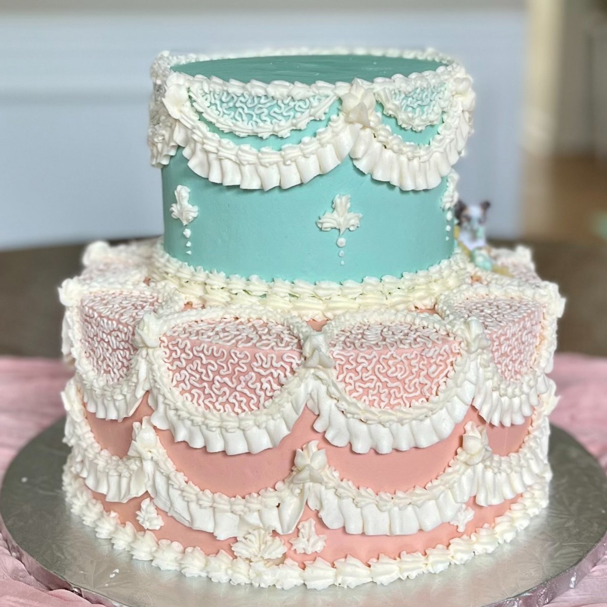 A two-tier pastel buttercream birthday cake with piped ruffles from Sweet Escape Cake Company in Indianapolis.
