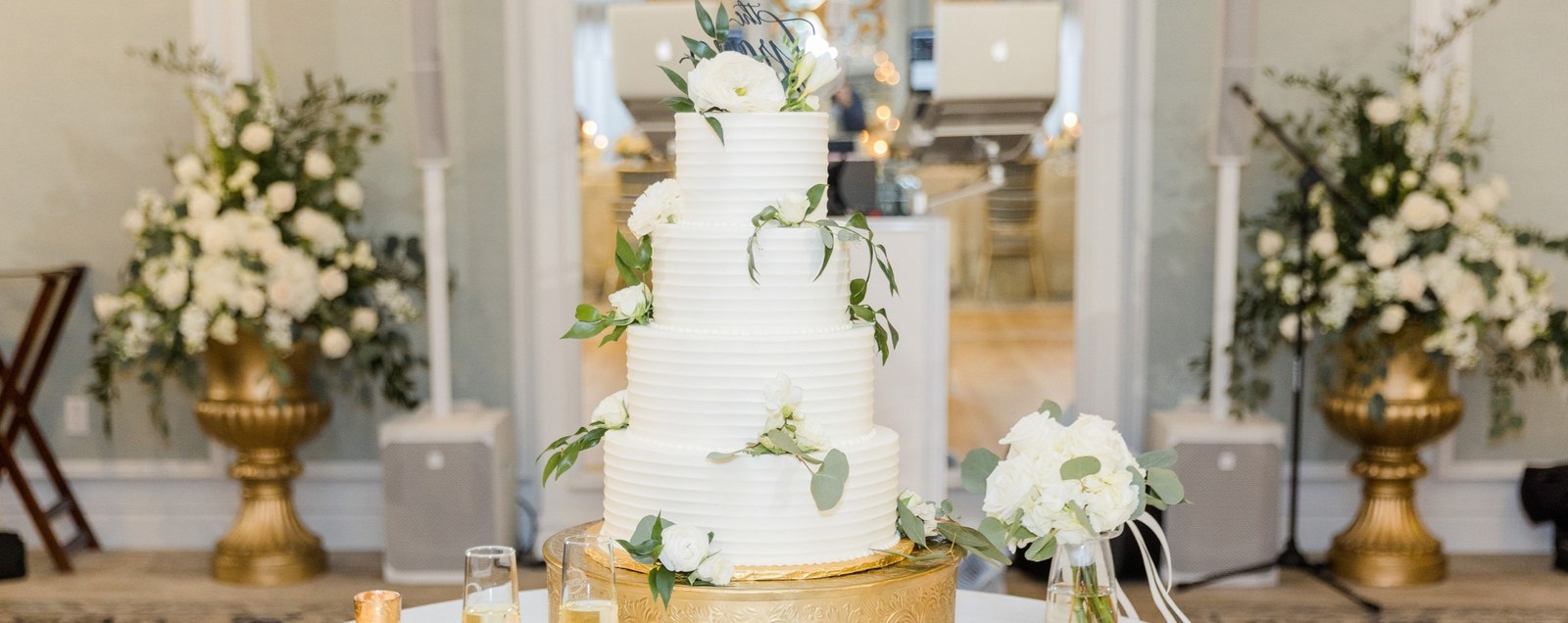 A five-tier white buttercream wedding cake by Sweet Escape Cake Company, one of the best custom cake bakeries in Indianapolis.