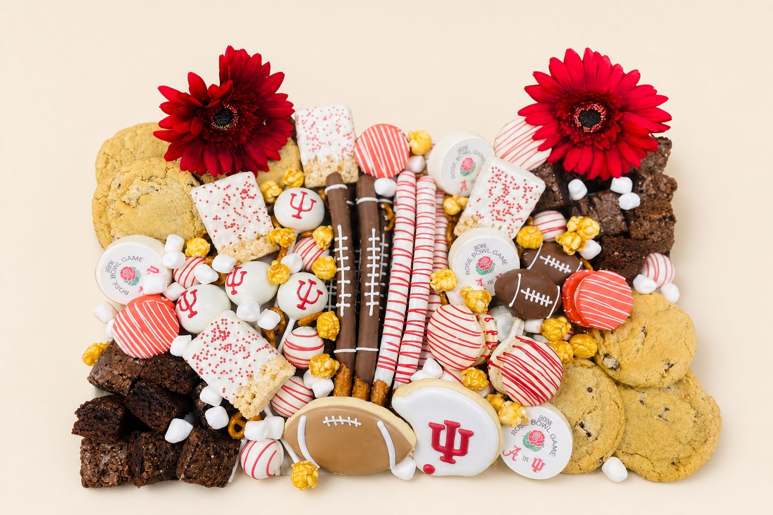 A football dessert board with decorated cookies, brownies, chocolate covered pretzels, rice krispie treats and cake pops, tailgate desserts from an Indianapolis bakery.