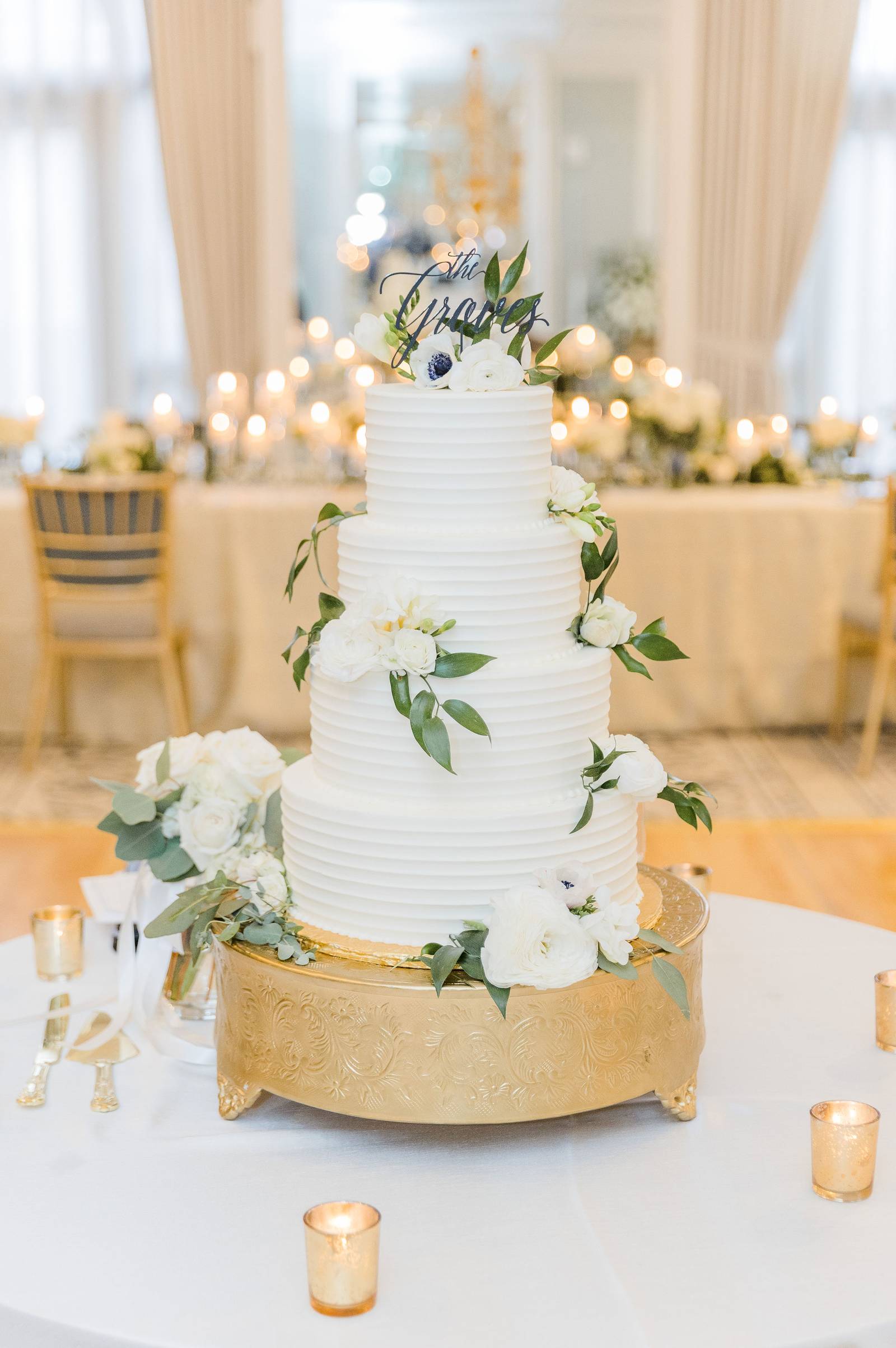 A tiered buttercream wedding display cake by Sweet Escape Cake Company in Indianapolis.