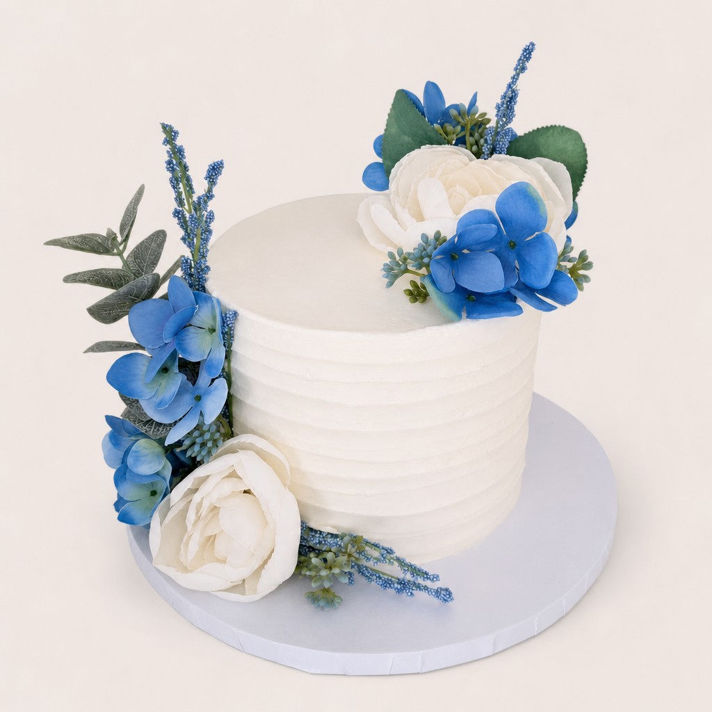 Single tier wedding display cake with blue hydrangea and white peonies by Sweet Escape Cake Company in Indianapolis.