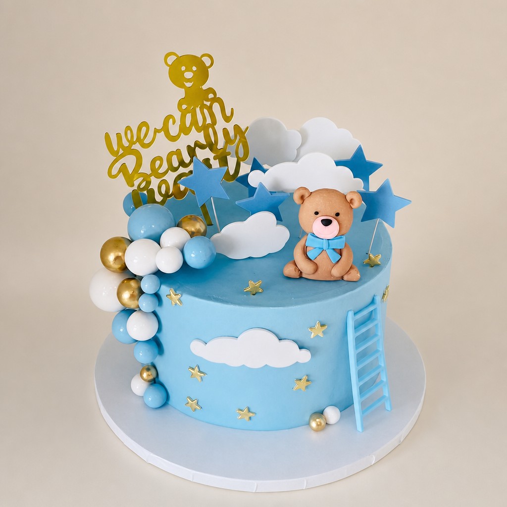 A teddy bear baby shower cake with a gold We Can Bearly Wait topper by Sweet Escape Cake Company in Indianapolis.