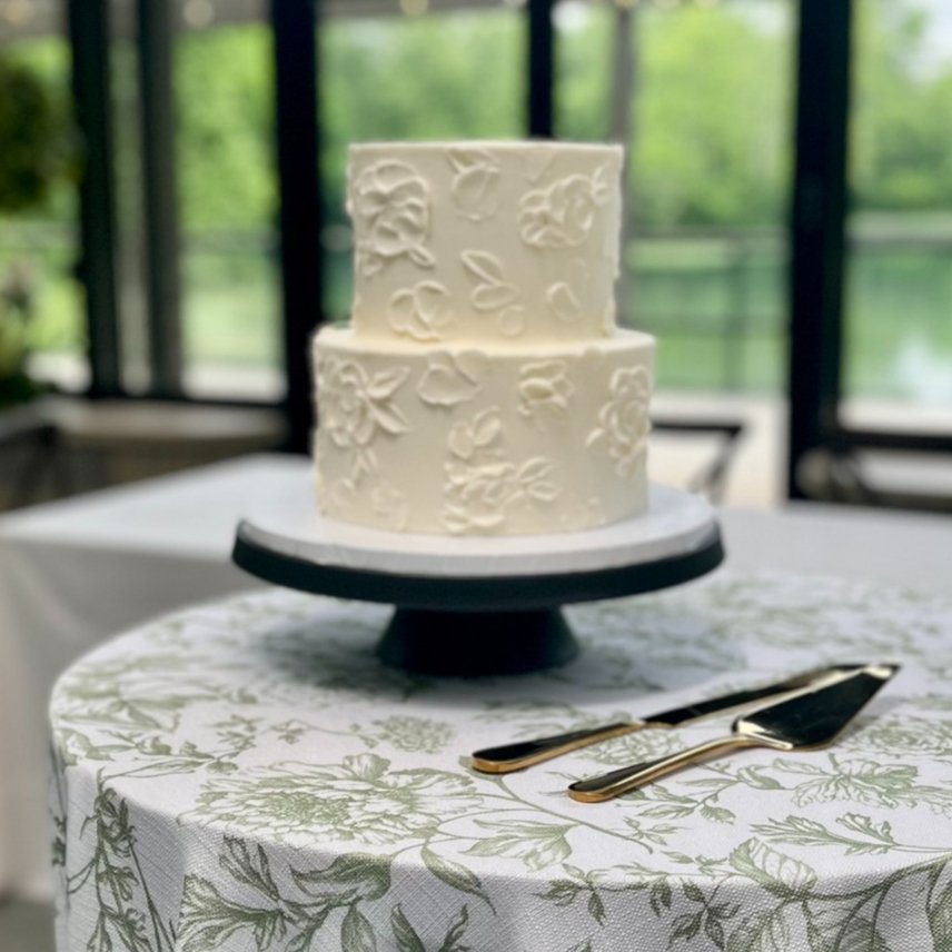 A simple two-tier white buttercream wedding cake, a budget-friendly Indianapolis wedding cake design by Sweet Escape.