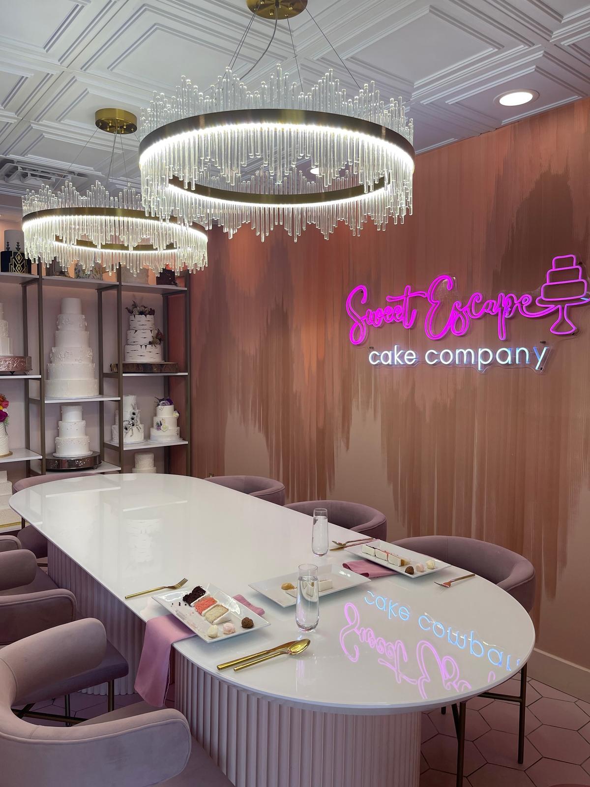 The tasting room door at Sweet Escape Cake Company in Indianapolis, where couples finalize wedding cake sizes and servings.