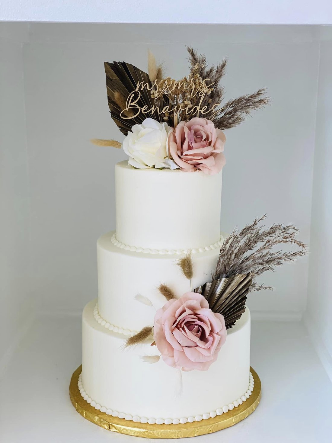 A tall multi-tier boho buttercream wedding cake by Sweet Escape Cake Company in Indianapolis.