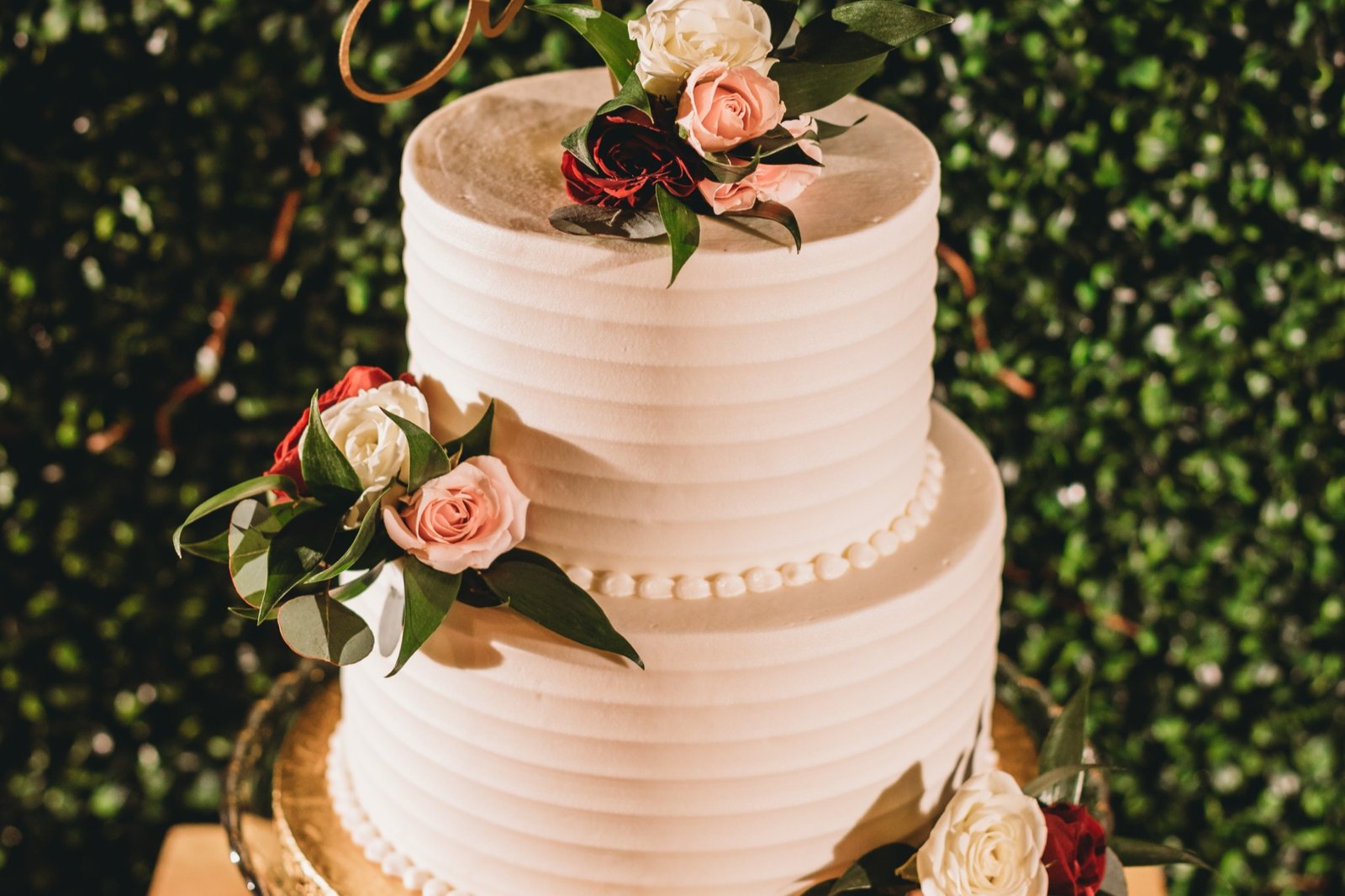 A two-tier buttercream garden wedding cake by Sweet Escape Cake Company in Indianapolis.