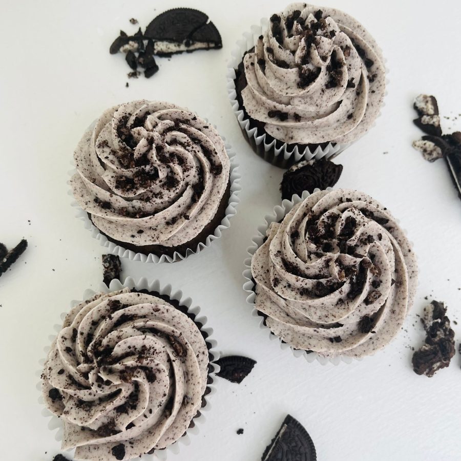 Delicious chocolate cupcakes topped with a swirl of cookies and cream buttercream frosting and sprinkled with crushed Oreo cookie pieces.
